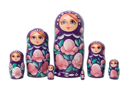 Make someone plumb happy when you gift them this lovely lady, all decked out in a very stylish plum dress adorned with green leaves. Although she stands only six inches doll, she houses a total of seven nesting dolls. The wee doll is quite delightfully