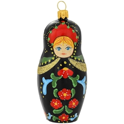 Who can resist the charming allure of a traditional Russian nesting doll? Our glass version is a hand-painted beauty depicting a young blond girl wrapped in a black dress with bright flowers. Shimmering with a myriad of vivid glazes and eye-catching glitt