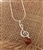 Hand made with Sterling Silver detail. Size is approx 1.5" long pendant on an 18" long sterling silver snake chain,
