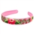 This is a flexible headband that has been covered in pink material that has been hand embroidered in a Lowicz style floral pattern. Made in Lowicz, Poland. No two are alike. Picture shows for examples. Price is for one headband.