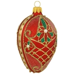 Incredibly detailed, this beautiful red matte egg features gold glitter lattice designs as well as festive poinsettias blossoming with red and green glitter. Masterfully crafted of glass in Poland, 3" tall ornament will add an "egg"-xtraordiary brillianc