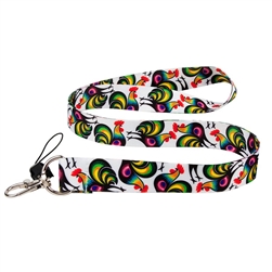 The lanyard is decorated with colorful roosters from the Lowicz cutout. The pattern on the lanyard is inspired by the traditional folk pattern from the Lowicz region. The leading elements of the cut-outs from Lowicz are roosters, peacocks and floral motif