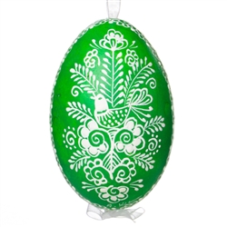 This beautifully designed egg is dyed one color, then white wax is melted and applied to form an intricate design which is left on the surfce. The egg is emptied and strung with ribbon for hanging.