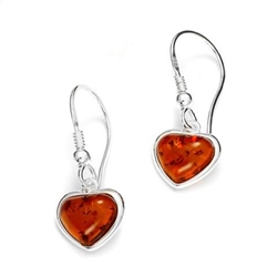 Dainty pair of amber hearts set in sterling silver with French hooks.  Size is approx 1" x .3".