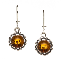 Honey amber framed in sterling silver. Stylish and unique.  Size is approx 1" x 0.4"