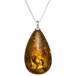 Beautiful amber cabochon on an adjustable silver chain. Pendant size is approx. 2" x 1.25" x 0.6.