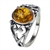 An oval of honey amber set in an artistic swirl of sterling silver.