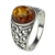 A nicely shaped oval amber cabochon set in an antique style sterling silver ring.  Size approx. 0.5" x 0.4"
