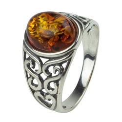 A nicely shaped oval amber cabochon set in an antique style sterling silver ring.  Size approx. 0.5" x 0.4"