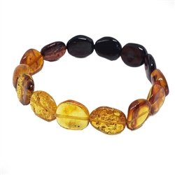 Multi Color Amber Rainbow Stretch Bracelet. Citrine, cognac, and cherry amber beads are set on elastic strings. Genuine Baltic amber stretch bracelet. Size is approx 7.75" diameter.