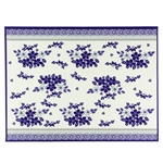 Large Polish cloth placemat featuring Polish stoneware colors and floral design. This is a thin material made of 100% polyester. Made in Poland.  Size is 15.25" x 11.75"