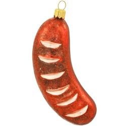 Carefully scored and grilled to perfection, our kielbasa sausage shimmers with vivid brown glazes and sparkling glitter accents and measures 4.5" tall. Artfully mouth blown and hand painted in Poland, our grilled sausage glass ornament makes a delicious