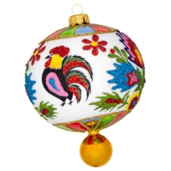This ornament is hand painted and was expertly crafted of glass in Poland and measures approximately 5.5" tall x 4" wide. This is a beautiful Polish paper cut (wycinanki) style design with roosters from the Lowicz region of central Poland.