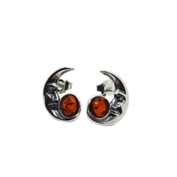 Cognac Amber Oxidized .925 Sterling Silver Moon Earrings. Amber stones set in oxidized .925 sterling silver. The shape of the stones is round. Stud earrings. Genuine Baltic Amber jewelry Size is approx 0.5" x 0.3"