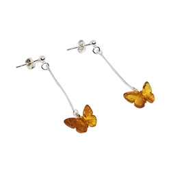 Baltic Amber Butterfly Earrings. Cognac Amber Butterfly Sterling Silver Post Dangle Earrings. Cognac amber set in .925 sterling silver. Genuine Baltic Amber jewelry.  Size is approx 1.5" x 0.5"