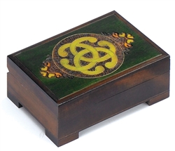 This box is decorated with a Celtic knotwork motif and accented with metal inlay. Box locks with an included key.  Size is approx 6" x 4" x 2.75".