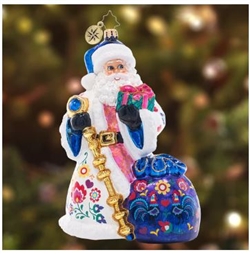 Santa is looking festive as ever in a cozy ensemble fashioned in the style of Polish floral folk art from the Lowicz region of central Poland. Uniquely colorful using a combination of hand-painting with decoupage elements, this piece is a truly beautiful