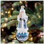 This snowflake-covered Santa stands upon a serene scene round, showcasing a beautiful silent night. This piece is an intricate and charming addition to any tree!
DIMENSIONS: 6 in (H) x 2.25 in (L) x 2.25 in (W)