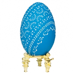 This beautifully designed egg is dyed one color then wax is melted and applied to form an intricate design which is left on the surface. The egg is emptied. Stand not included.