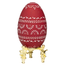 This beautifully designed egg is dyed one color then wax is melted and applied to form an intricate design which is left on the surface. The egg is emptied. Stand not included.