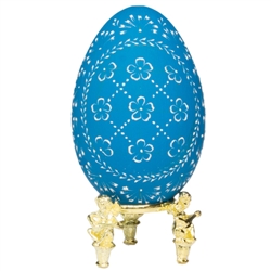 This beautifully designed egg is dyed one color then wax is melted and applied to form an intricate design which is left on the surface. The egg is emptied. Stand not included.