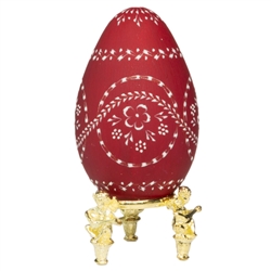 This beautifully designed egg is dyed one color then wax is melted and applied to form an intricate design which is left on the surface. The egg is emptied. Stand not included.