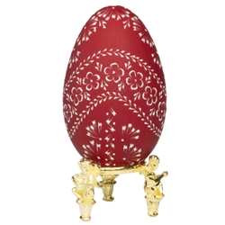 This beautifully designed egg is dyed one color then wax is melted and applied to form an intricate design which is left on the surface. The egg is emptied. Stand not included.