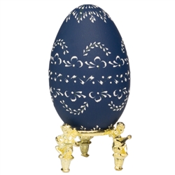 This beautifully designed egg is dyed one color then wax is melted and applied to form an intricate design which is left on the surface. The egg is emptied. Stand not included.