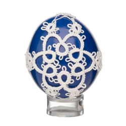 This beautifully designed chicken egg is painted and surrounded in a tatted design. Stand sold separately.