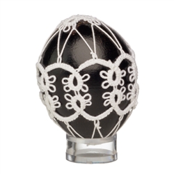 This beautifully designed chicken egg is painted and surrounded in a tatted design. Stand sold separately.