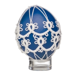 This beautifully designed chicken egg is painted and surrounded in a tatted design. Stand sold separately.