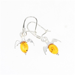 Cognac Amber Sterling Silver Bat earrings On Hooks. Oval-shaped amber stones set in .925 sterling silver. Genuine Baltic amber. Size is approx 1" x 0.5".