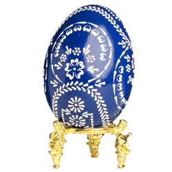 This beautifully designed egg is dyed one color then wax is melted and applied to form an intricate design which is left on the surface. The egg is emptied. Stand not included.