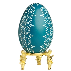 This beautifully designed egg is dyed one color then wax is melted and applied to form an intricate design which is left on the surface. The egg is emptied. Stand not included.