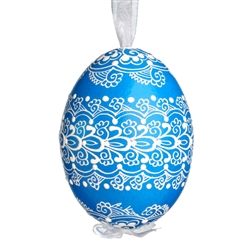 This beautifully designed egg is dyed one color, then white wax is melted and applied to form an intricate design which is left on the surfce. The egg is emptied and strung with ribbon for hanging.