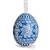 This beautifully designed egg is dyed one color, then white wax is melted and applied to form an intricate design which is left on the surfce. The egg is emptied and strung with ribbon for hanging.