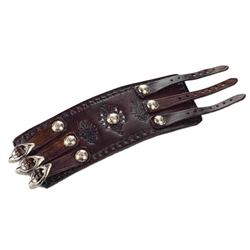 A solid piece of leather made this Wrist Band. It is adorned with nickel silver studs and buckles, and intricate tool worked designs in the leather . Made entirely by hand, this high quality piece is a work of art which any one would be proud to own. It