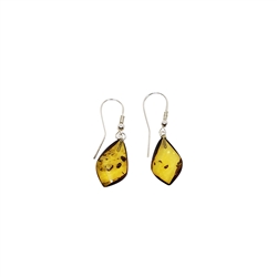 Natural Amber Free Form Earrings. Earrings on hooks. Free form natural color amber stones set on .925 sterling silver hooks. The shape of the stones is tear drop. Due to natural amber properties, the number of inclusions may vary. The shapes of the stones