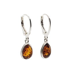 Baltic Amber Sterling Silver Earrings. Cognac Amber Sterling Silver Dangle Earrings. Teardrop-shaped amber stones set in .925 sterling silver. Dangle earrings on silver french hooks. Genuine Baltic Amber jewelry. Size is approx 1" x 0.25"