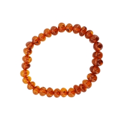 Cognac Amber Stretch Bracelet. Amber beads  are set on an elastic cord. Genuine Baltic amber. Approx 6.75" before stretching.