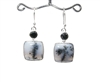 dendritic opal earrings aka merlinite cabochons in milky white with black splashes form a scenic image 1-1/2" in .925 sterling silver.