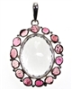 clear quartz faceted oval stone with 14 pink tourmaline surrounding pebble stones 2-1/4" commanding piece