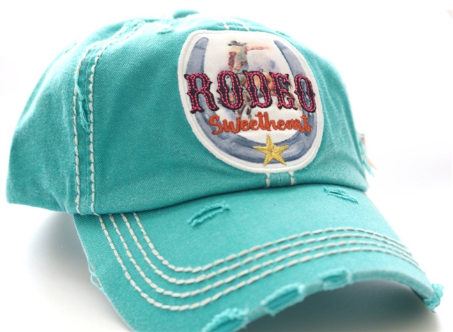ponytail cap says rodeo sweetheart with horseshoe in front distressed style teal color
