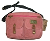 Canvas bag, long shoulder strap.  Front saddle bag pouches with snaps, lined interior with large zippered pockets plus exterior zippered pocket.