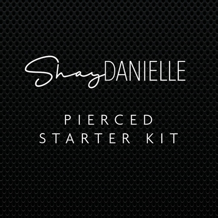 Complete body piercing kit with clamps, needles, and supplies