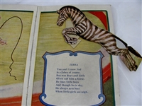 The Happy Family Movable Picture Book by Buzza, circa 1920. Includes original removable cardboard figures and slot-based interactive scenes.