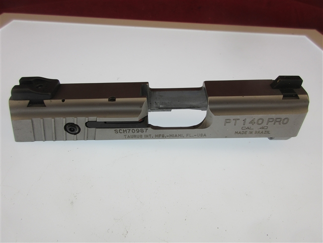 Taurus PT 140 Millennium Pro Slide Assembly. .40 S&W
â€‹Includes Firing Pin, Sights & Extractor