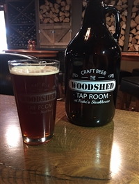 Growler of beer in our Woodshed lounge