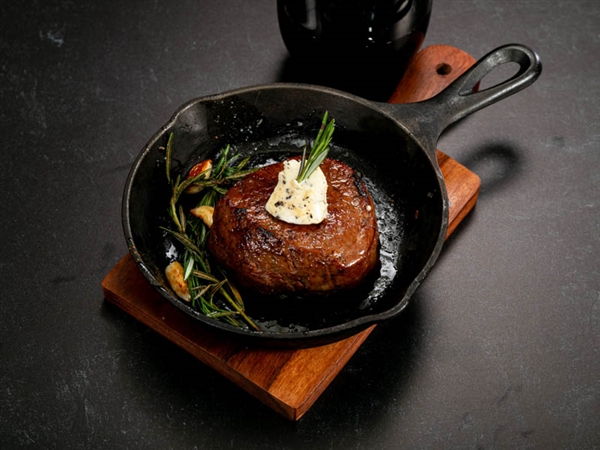 Rube's tender filet mignon seasoned with pink peppercorns