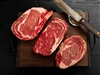 Grilled cowboy cut ribeye with herbed butter